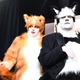 Rebel Wilson and James Corden stand backstage in cat costumes during the Academy Awards.